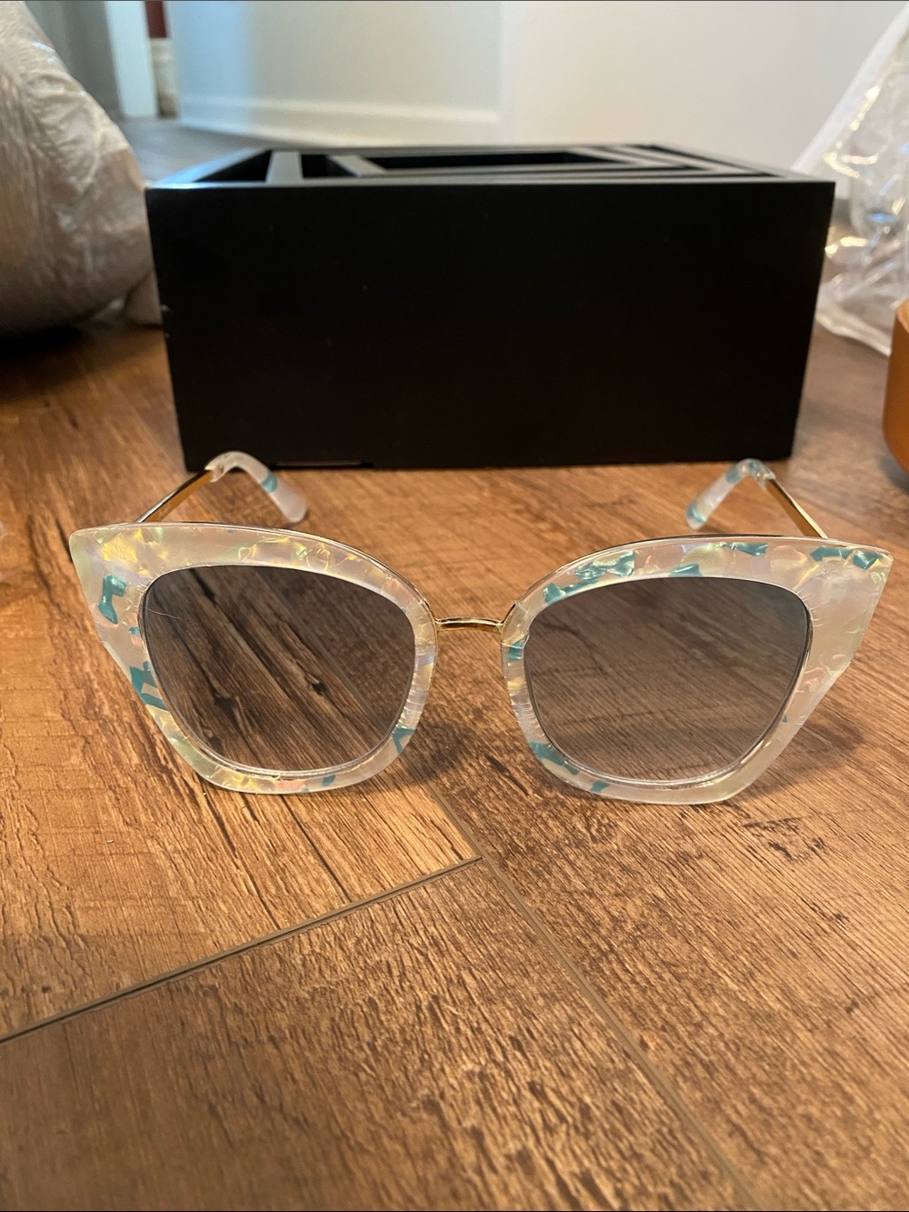 Free People Iridescent Clear Cat-Eye Sunglasses with Blue Accents